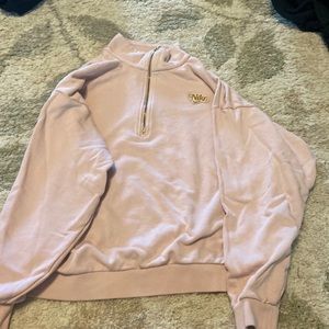 Pink Nike quarter zip with gold logo